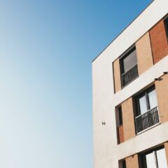 white and brown concrete building under blue sky during daytime